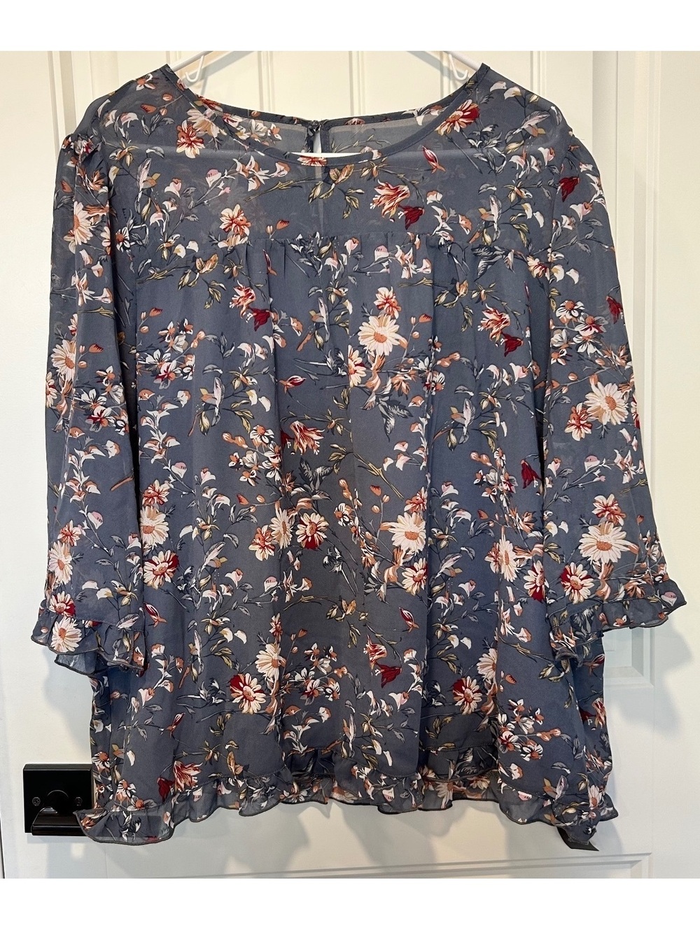 NWT Allegra K sheer blouse in blue with a floral print a ruffled edge and cuffs